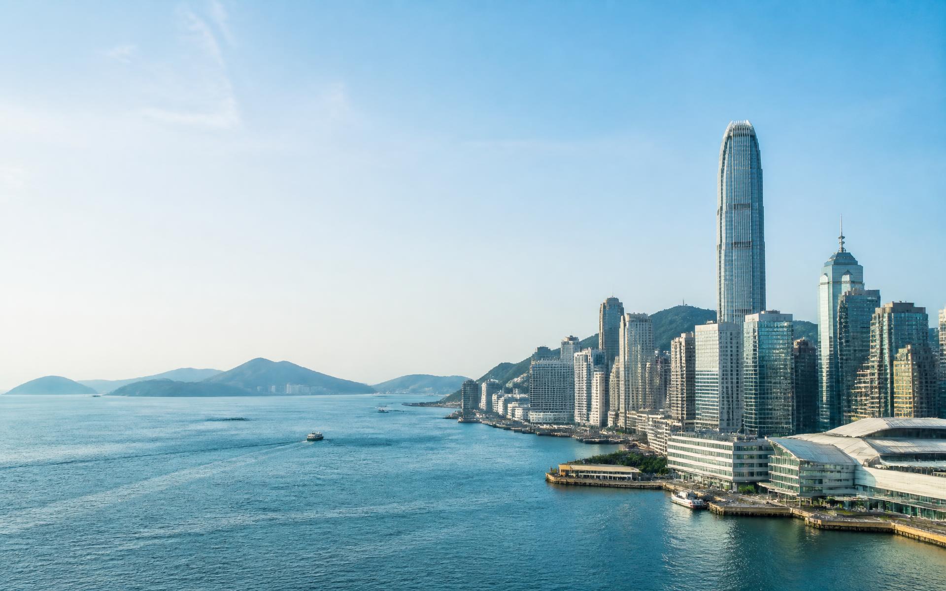 Sunlit Hong Kong waterfront and city skyline